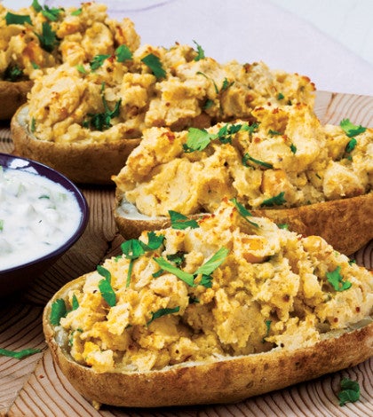Indian Twice-
Baked Potatoes with Cucumber Yogurt Sauce image None
