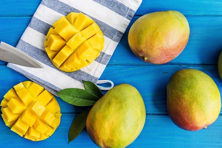 Fresh mangos being cut