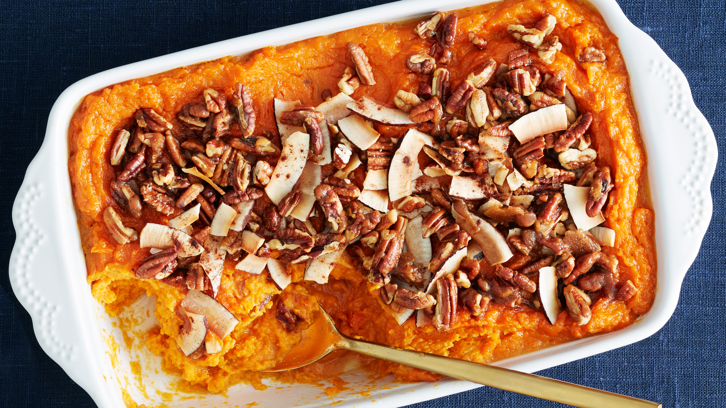 https://cdn.cleaneatingmag.com/wp-content/uploads/2018/03/sweet-potato-casserole-with-coconut-pecans_77.png