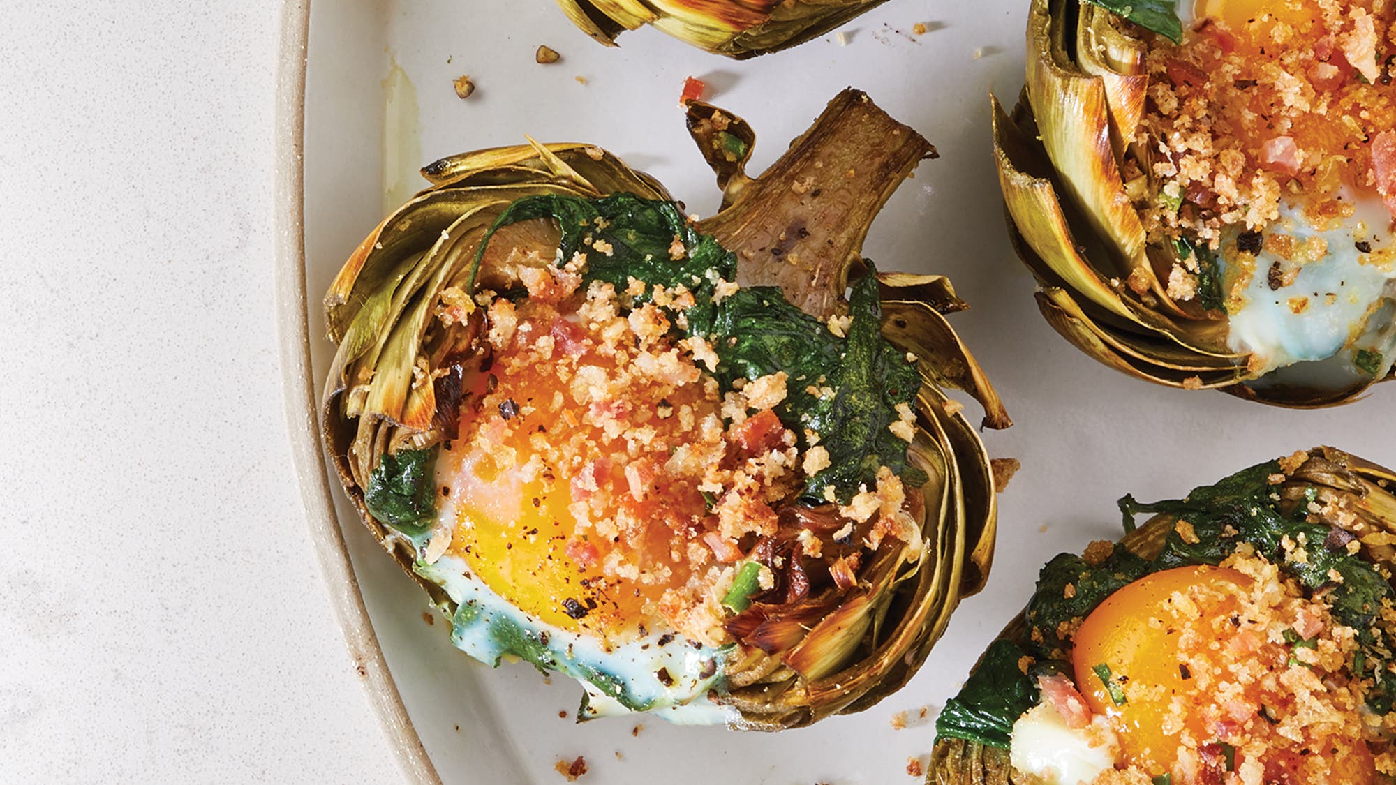 Baked Eggs in Artichokes with Bacon Chive Bread Crumbs recipe