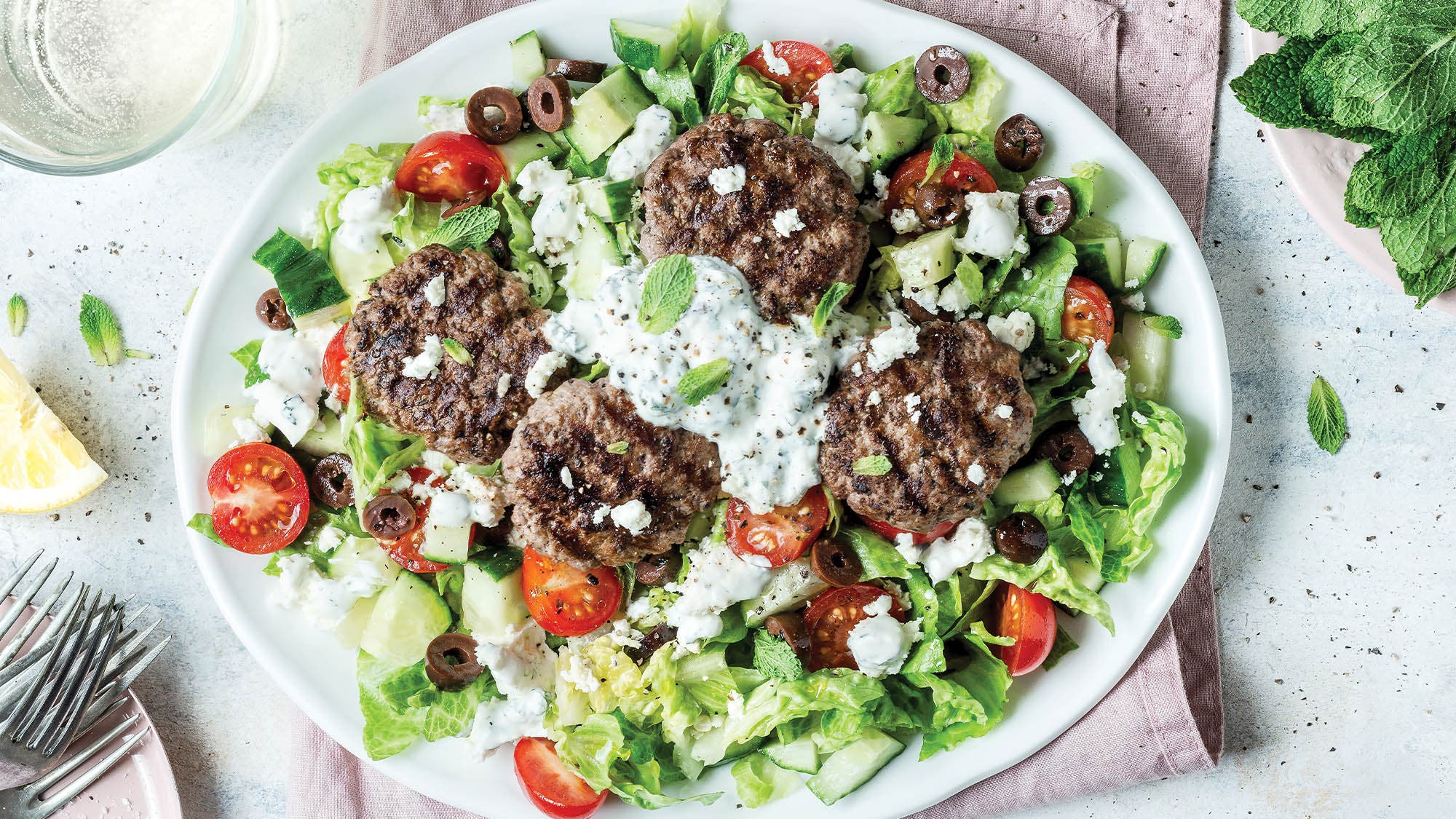 Greek Lamb Burger Salad with Yogurt Feta Drizzle recipe