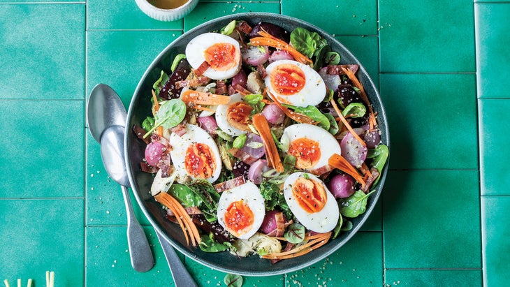 Spinach Salad with Crispy Artichokes & Basil Dressing in a bowl