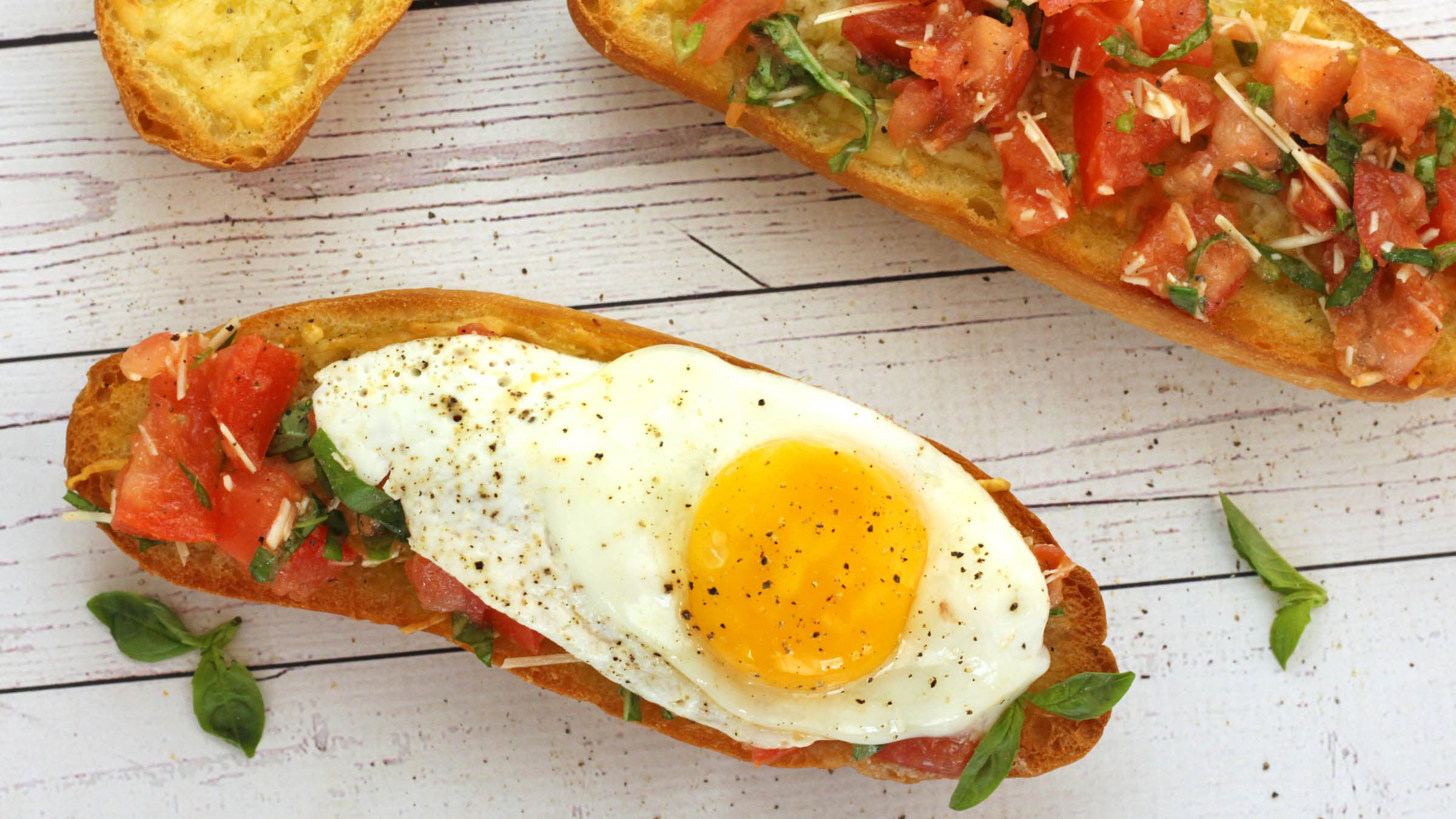 Egg and tomato over bruschetta