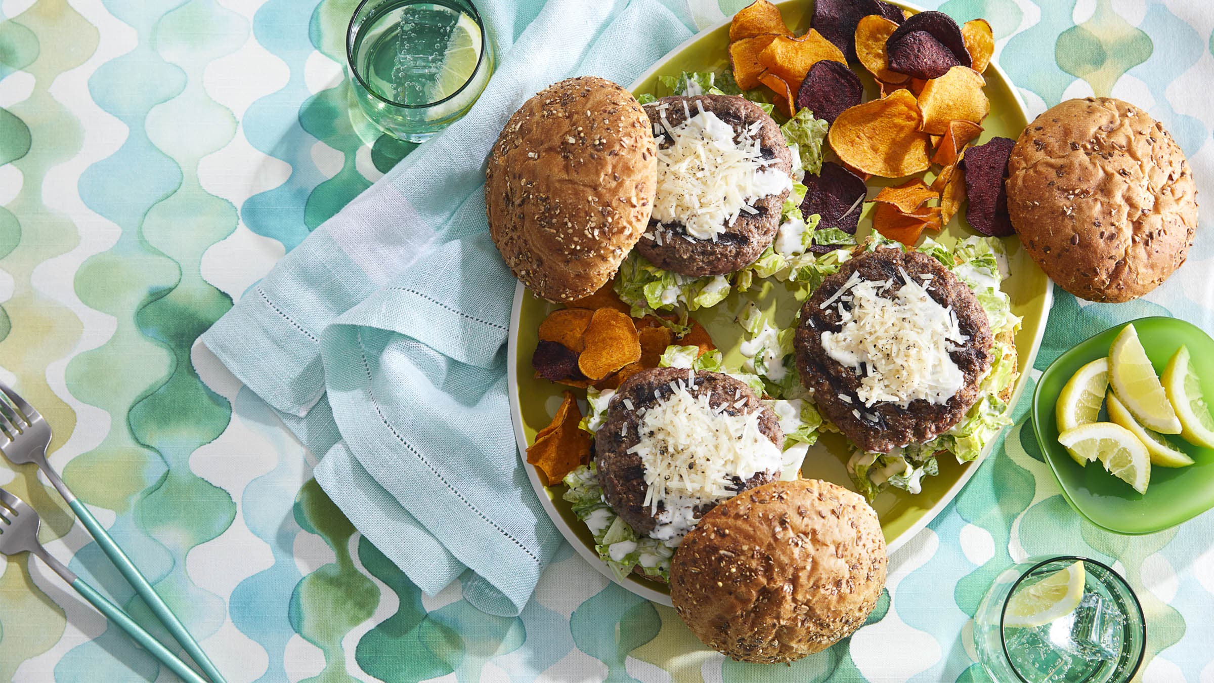 Caesar burgers on colorful tablecloth