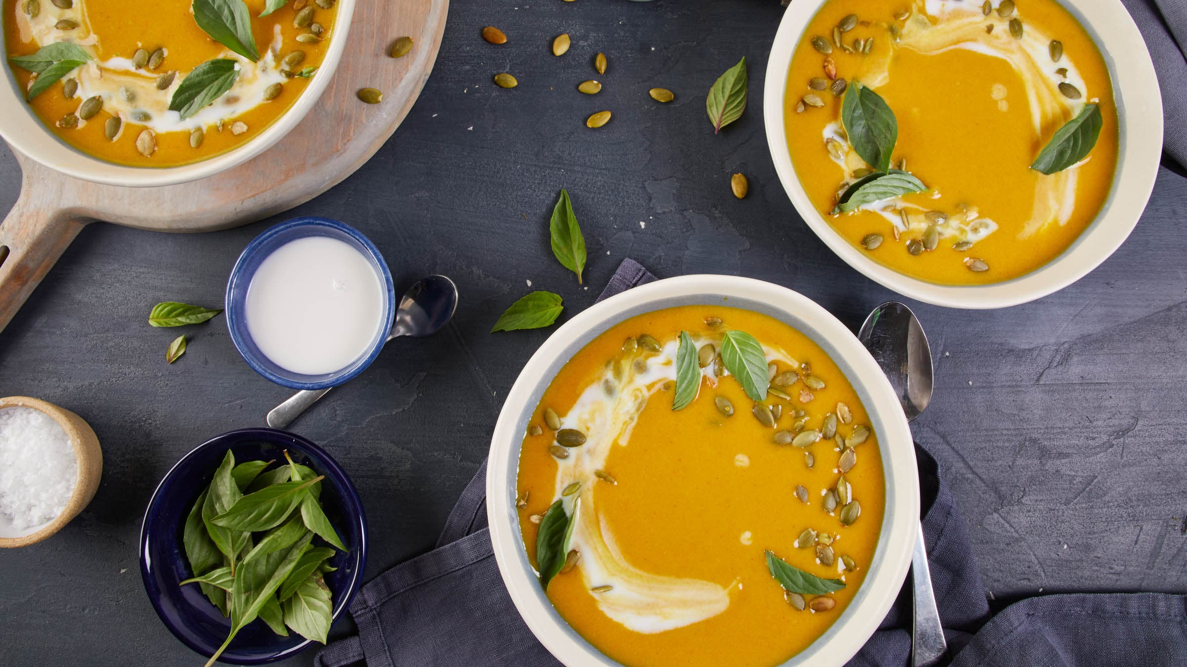 Three bowls of coconut squash soup