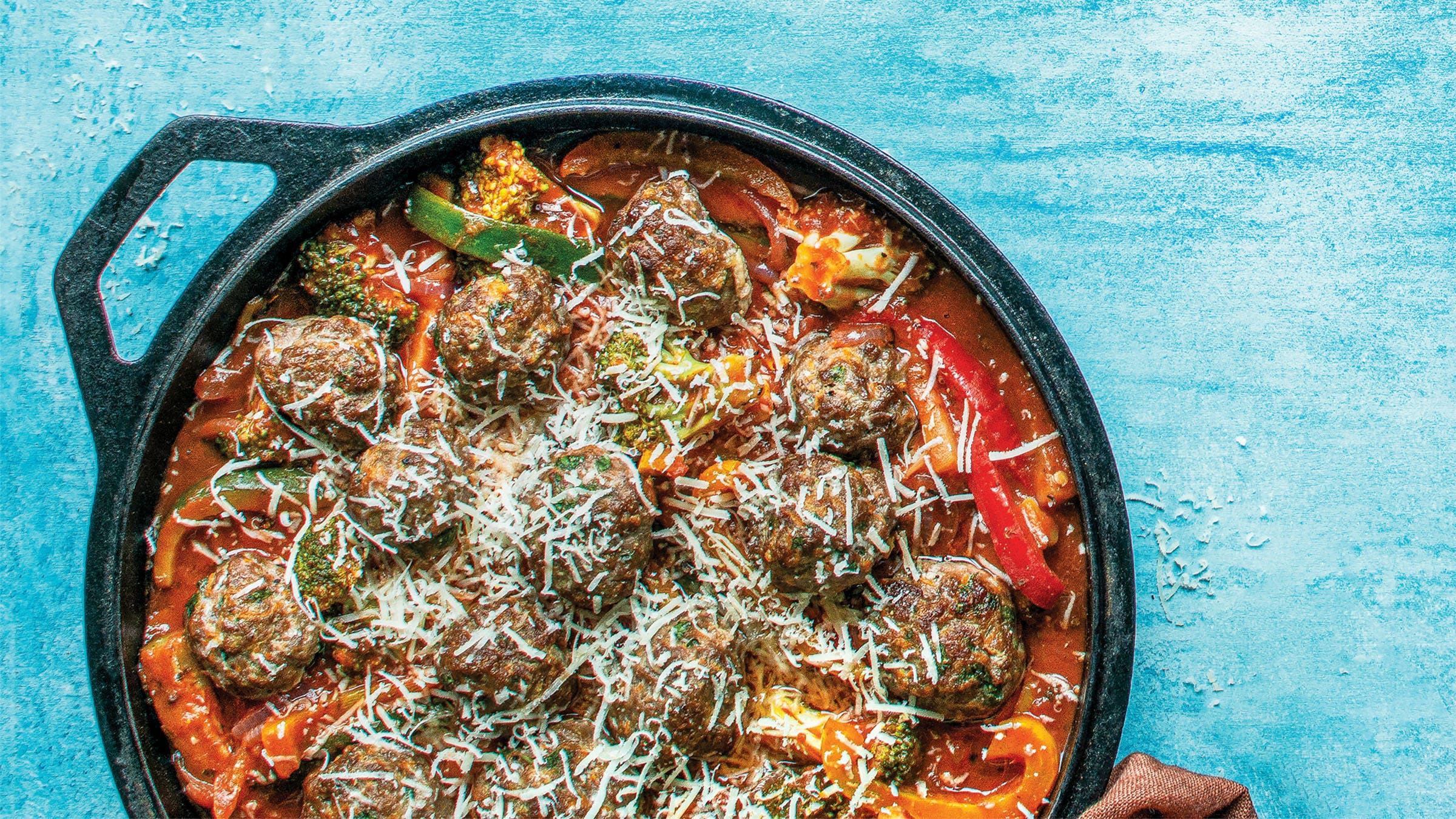 Parmesan meatballs over vegetable ragu