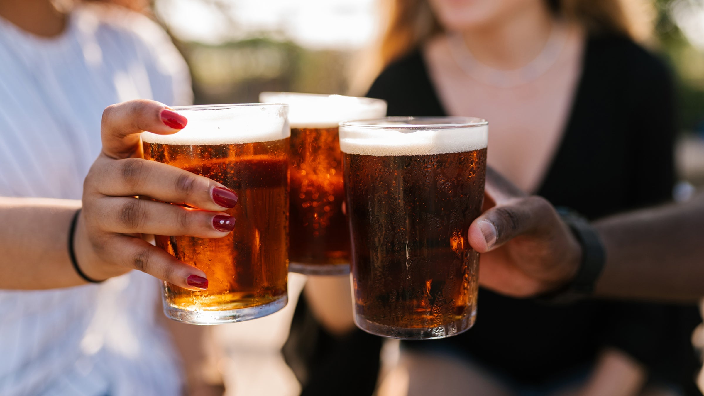 Friends toasting with beer