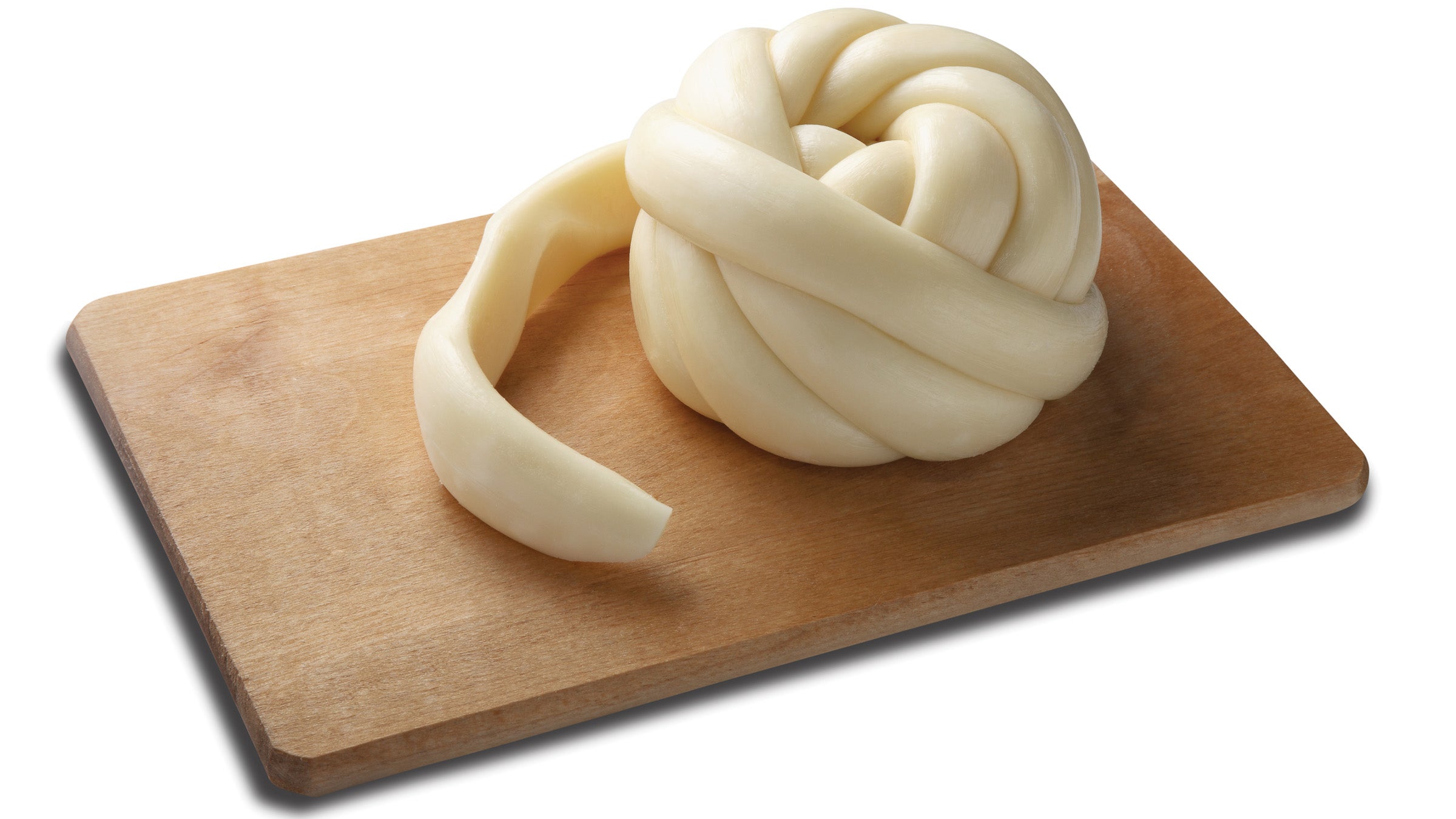 Oaxaca cheese on a board on white background